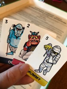 A hand showing a monster worth 3, a monster worth 2 and a mummy worth 5