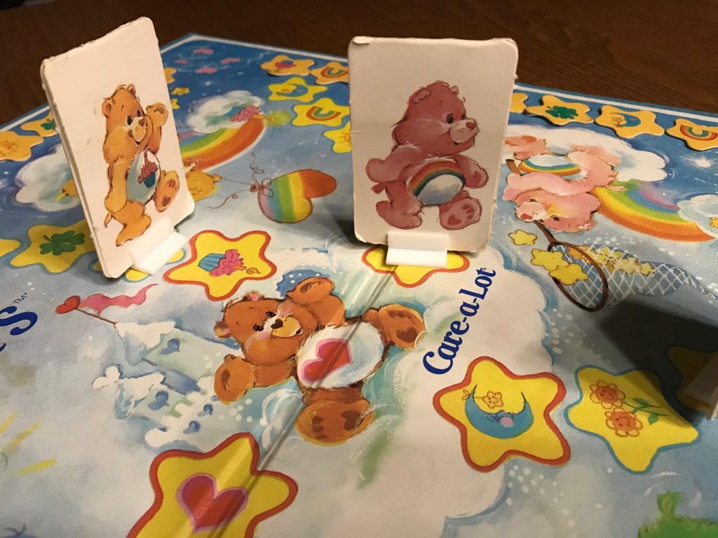 Care Bear pawns are made of cardboard in a standee