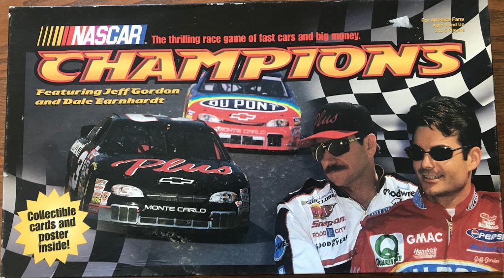 Cover shows two racers next to a race car