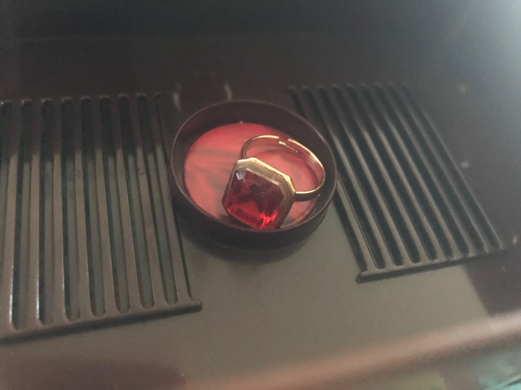 The ring is red and gold and sizing is flexible because it expands