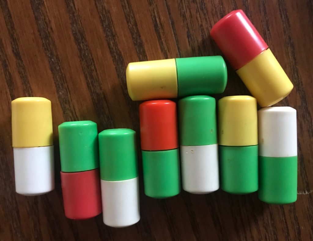 The pegs are two colors, like yellow/white, green/red, green/white, etc