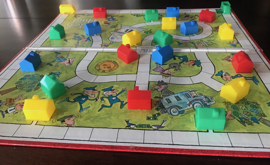 The board set up for play showing houses all over the board