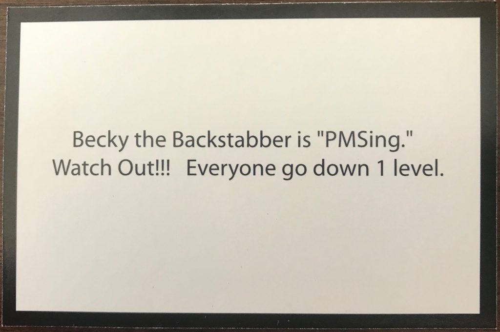 This card says one of the characters is PMS'ing so everyone goes down one level