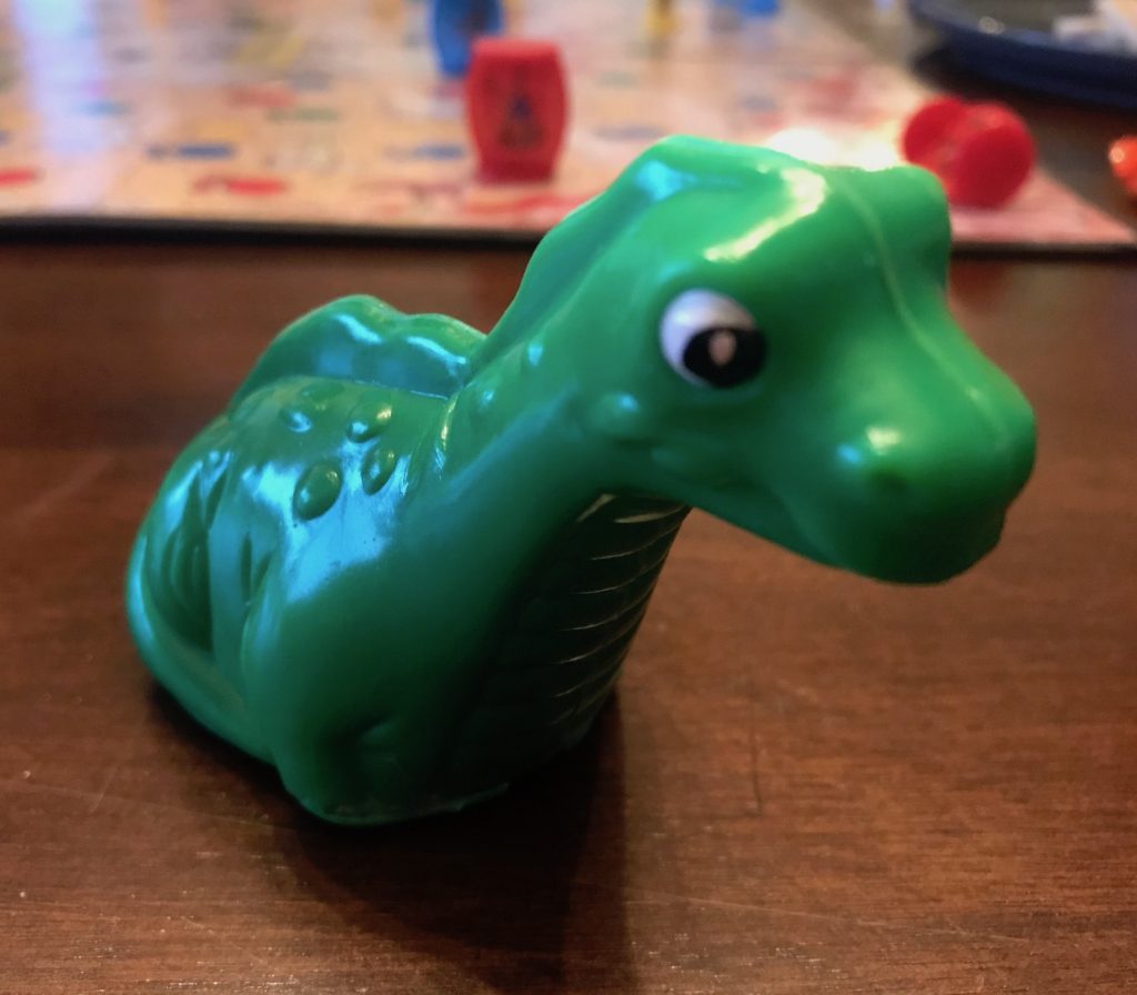 The dinosaur is a green wind up toy