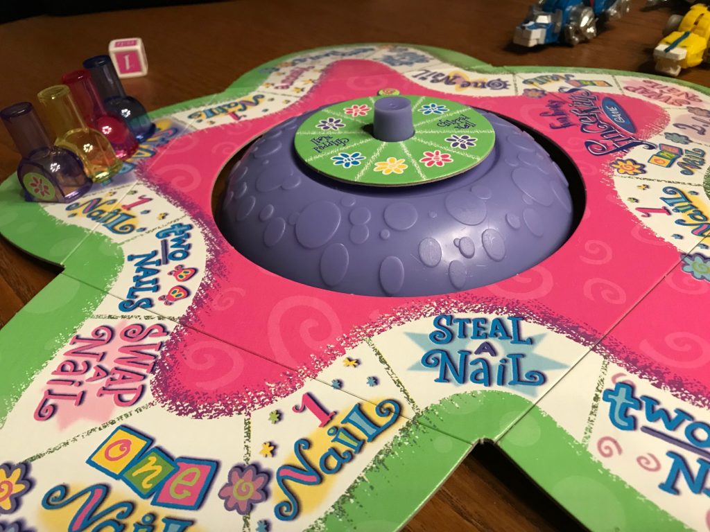 The game board with a spinner in the middle