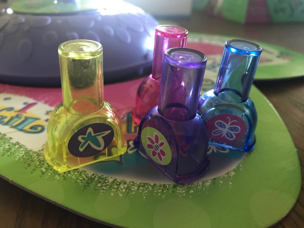 The pawns are semi-clear sparkly plastic nail polish bottles