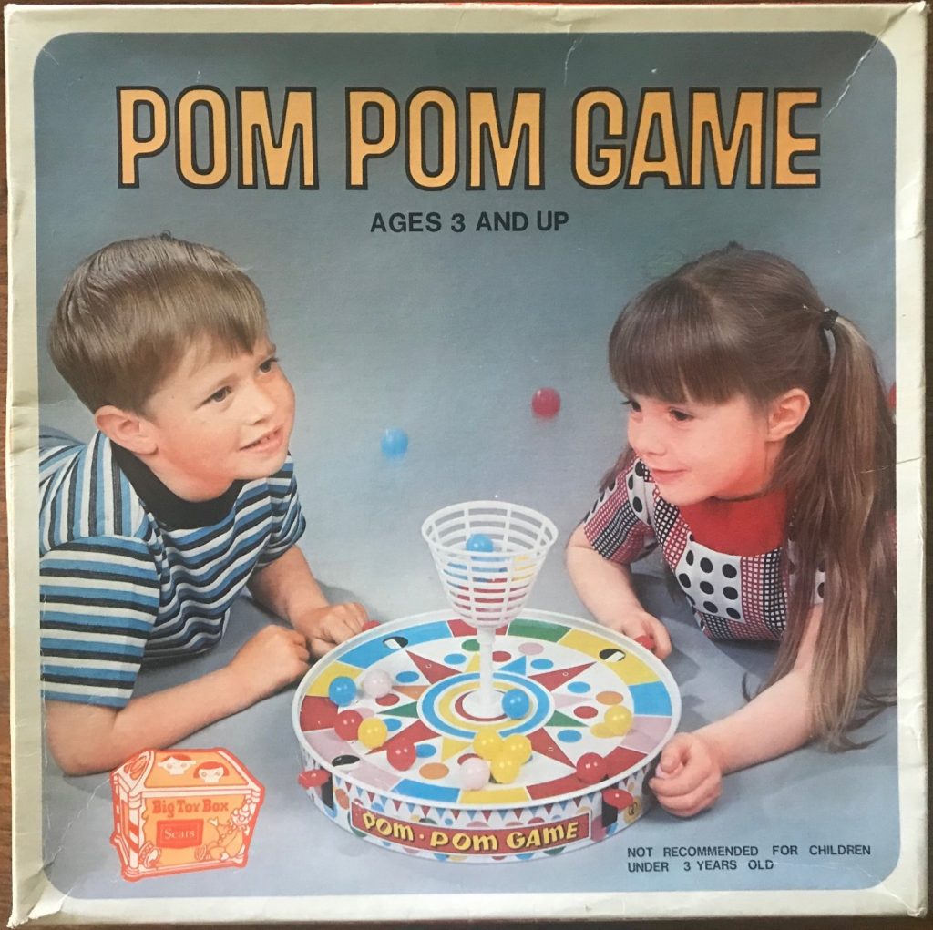 Two children are launching balls into the basket on the cover