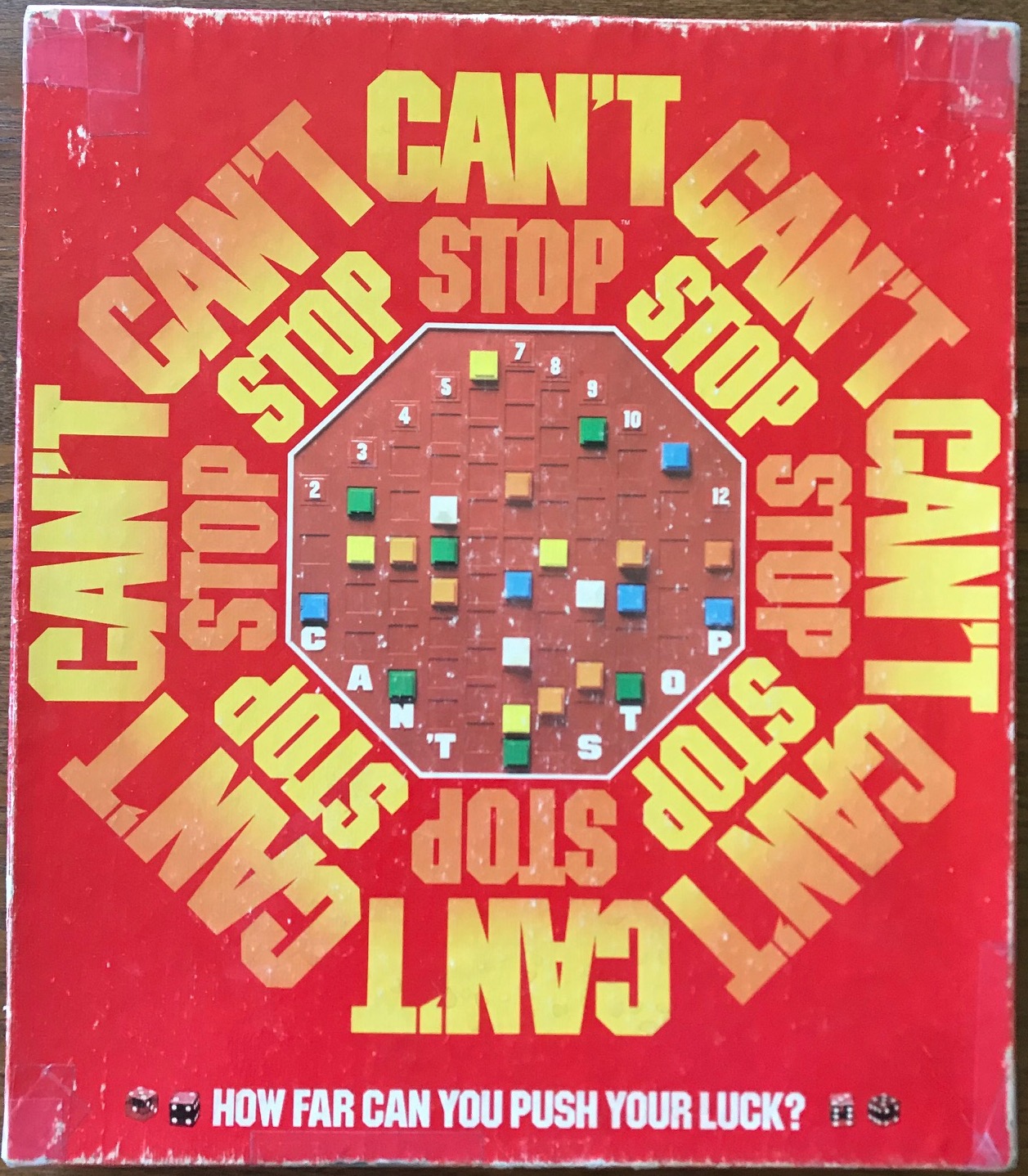 This cover is red and says "Can't Stop" in all 8 directions like a stop sign, with the board in the middle