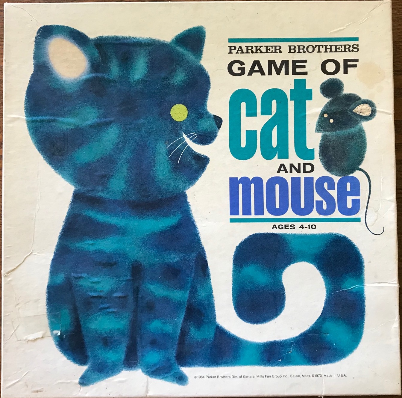 Cover has a blue kitty with the title on top of its curved tail