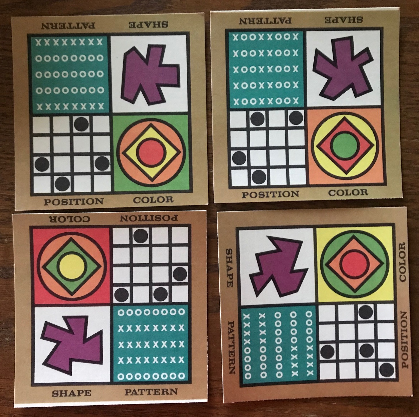 Four sample tan cards showing four different design patterns on each