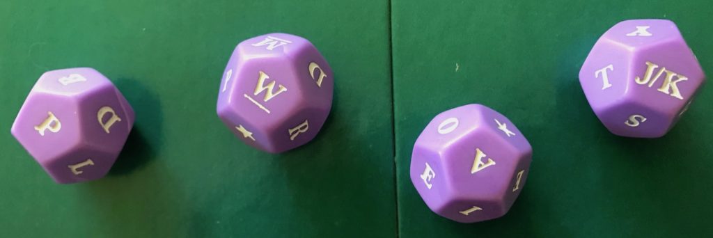 An example roll of the dice showing letters P, W, A and J/K