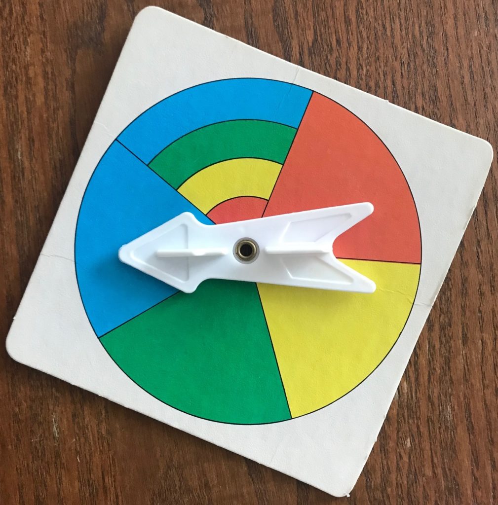 Spinner showing orange, yellow, green, blue and one slice that is combo of all