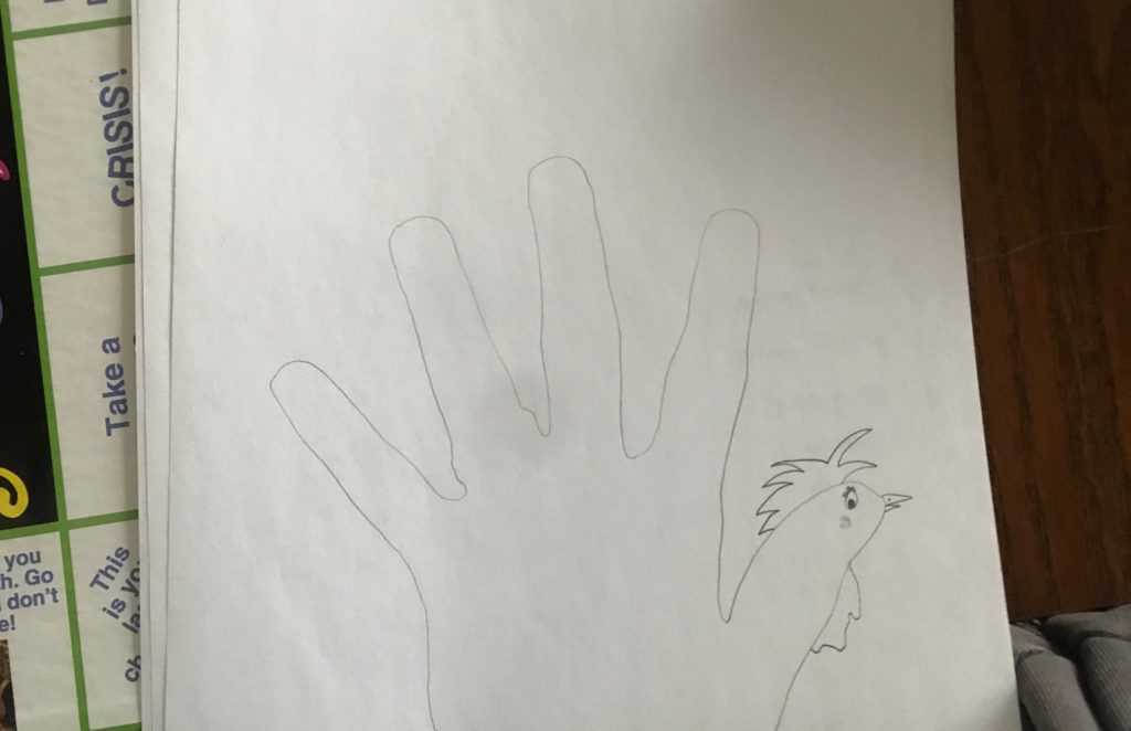 A sketch of someone's hand that they turned into a turkey