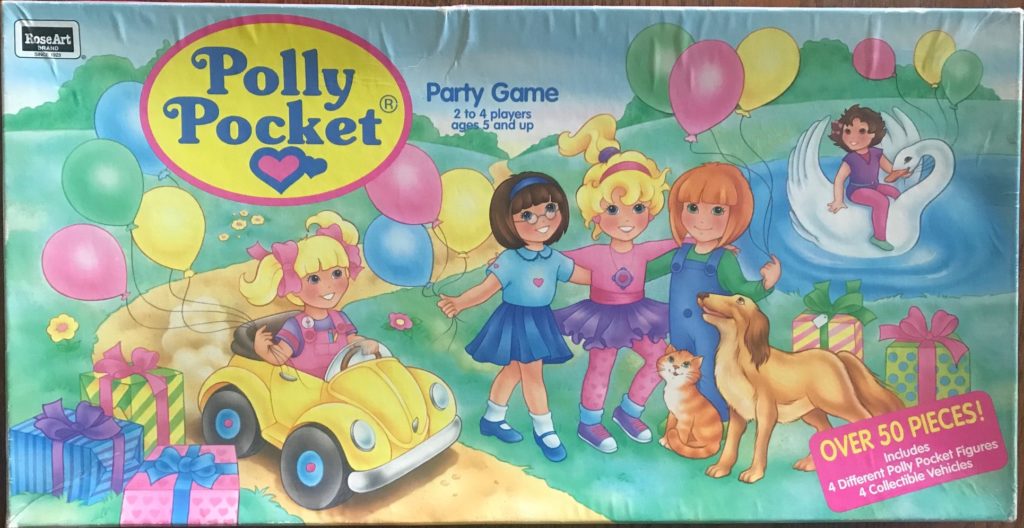 Cover shows cartoon Polly Pockets standing on some grass looking happy
